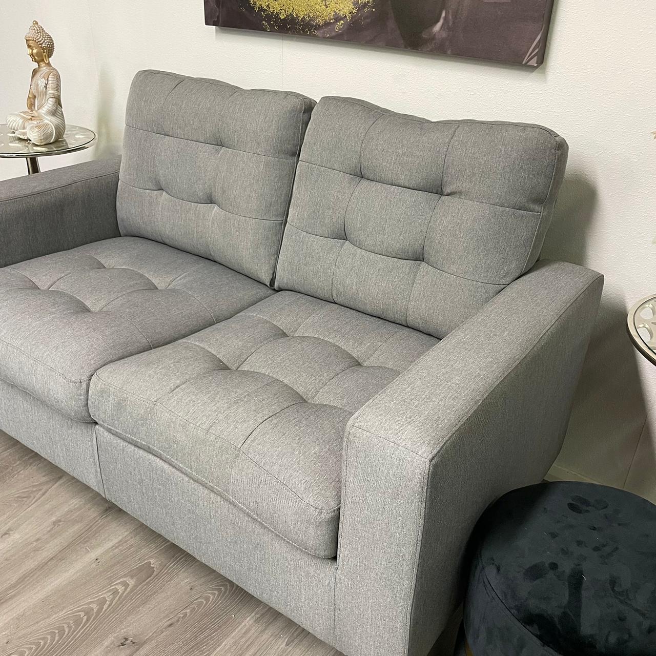 Grey two-seater sofa – Modern and compact style